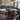 Metal cross backed dark wooden Cambridge bar chairs around a table in a pub