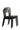 Stack of black plastic dining chairs