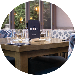 Close up of a chunky square dining table