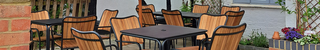Metal and wooden panel outdoor chairs in a beer garden