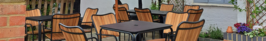 Metal and wooden panel outdoor chairs in a beer garden