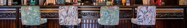 Four bar chairs lined up 