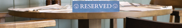 Reserved sign on wooden table