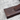 Dark wooden door handle on a textured surface