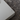 Close-up of a white rectangular object on a textured gray surface
