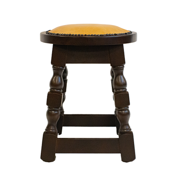 Wooden stool with a cushioned seat on a white background