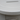 Close-up of a white ceramic bowl with a subtle texture on a neutral background