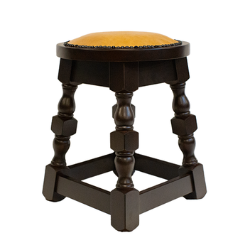 Wooden stool with a yellow cushion on a white background