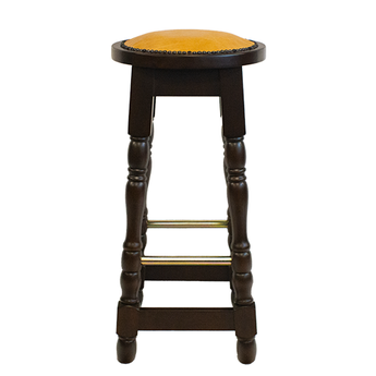 Wooden bar stool with a yellow cushioned seat on a white background