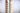 Two twisted wooden table legs on a light gray background