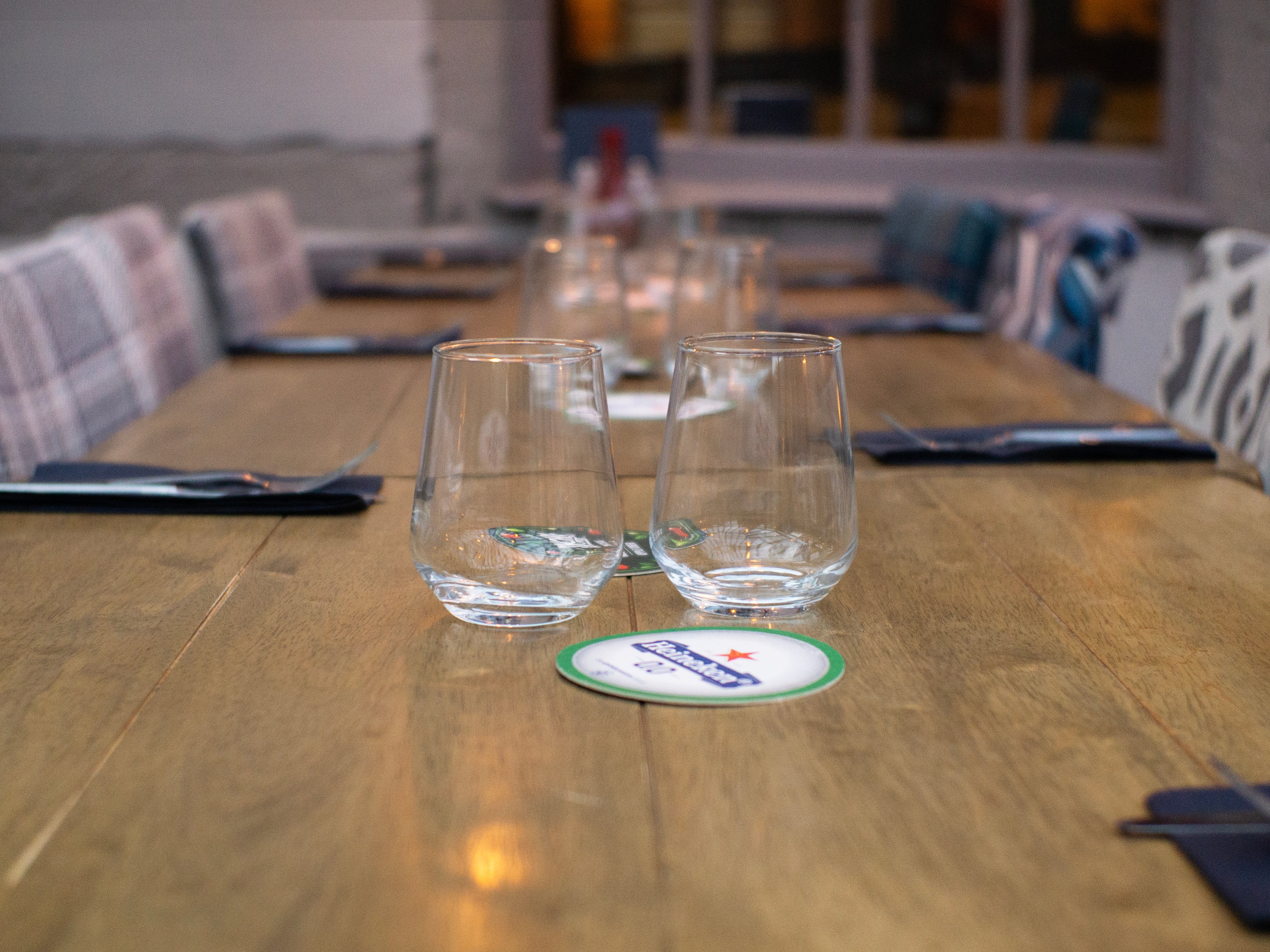 Restaurant with Luigi dining chairs, chunky wooden square dining tables and farmhouse tables