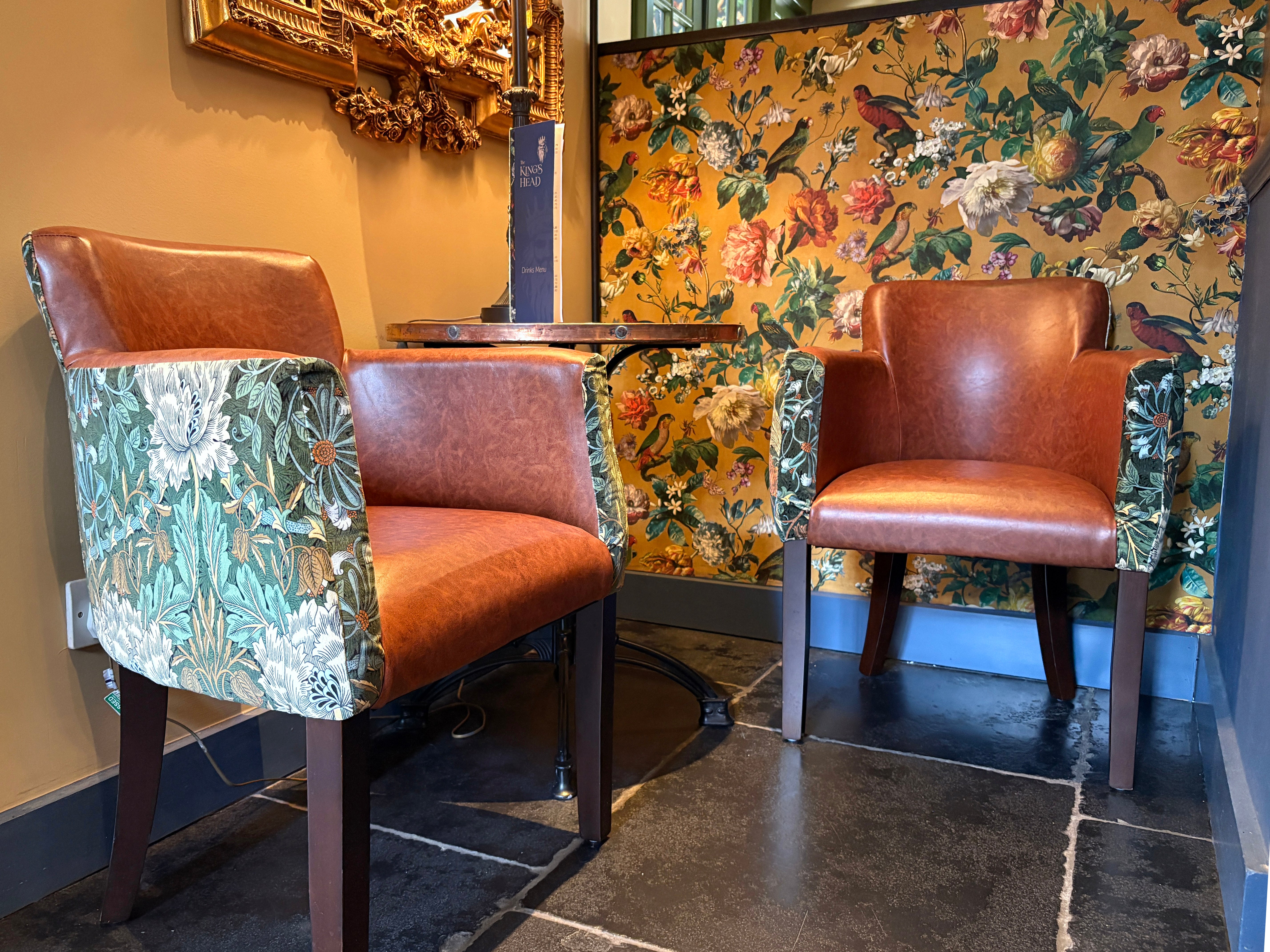 Two Lisbon tub chairs with a William Morris floral fabric outer and tan vinyl inner